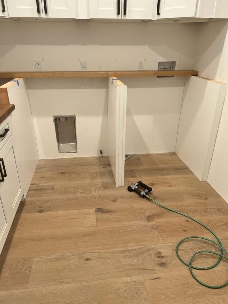 Modern kitchen renovation with custom cabinetry and hardwood flooring.